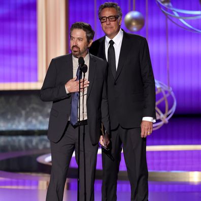 LOS ANGELES, CALIFORNIA - SEPTEMBER 14: (L-R) Ray Romano and Brad Garrett speak onstage during the 77th Primetime Emmy Awards at Peacock Theater on September 14, 2025 in Los Angeles, California. (Photo by Kevin Winter/Getty Images)