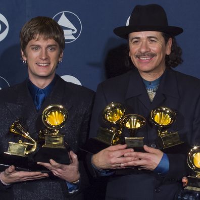Carlos Santana, Rob Thomas and Clive Davis backstage at the Grammy Awards Show, February 23, 2000 in Los Angeles, California. 