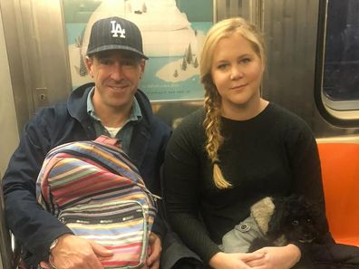 Schumer, 44, announced her split from Chris Fischer, 45, in a casually worded Instagram post, accompanied by a photo of them sitting side-by-side on the train. 