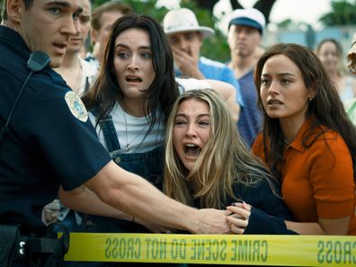 Sarah Pidgeon, Madelyn Cline, center, and Chase Sui Wonders, right, in a scene from I Know What You Did Last Summer