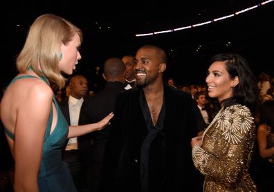 Kayne West, with then wife Kim Kardashian, and Taylor Swift at the 57th Annual GRAMMY Awards on February 8, 2015, where they made up six years after their feud. 