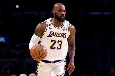 LeBron James brings the ball up court.