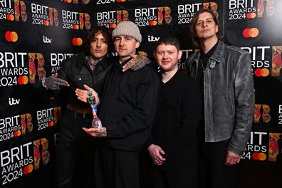 LONDON, ENGLAND - MARCH 02: (EDITORIAL USE ONLY. NO PUBLICATIONS DEVOTED EXCLUSIVELY TO THE ARTIST) (L-R) Oliver Sykes, Matt Nicholls, Lee Malia, and Matt Kean of "Bring Me The Horizon" pose with their Best Alternative/Rock Act award in the winners room at the BRIT Awards 2024 at The O2 Arena on March 02, 2024 in London, England. (Photo by Kate Green/Getty Images)