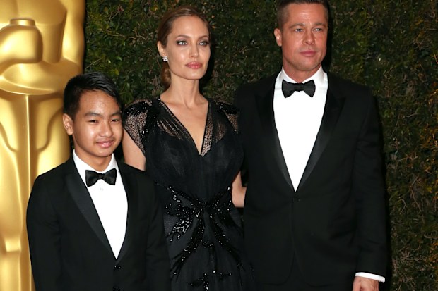 Maddox Jolie-Pitt with parents Angelina Jolie and Brad PItt at the Academy of Motion Picture Arts and Sciences' Governors Awards in November 2013.